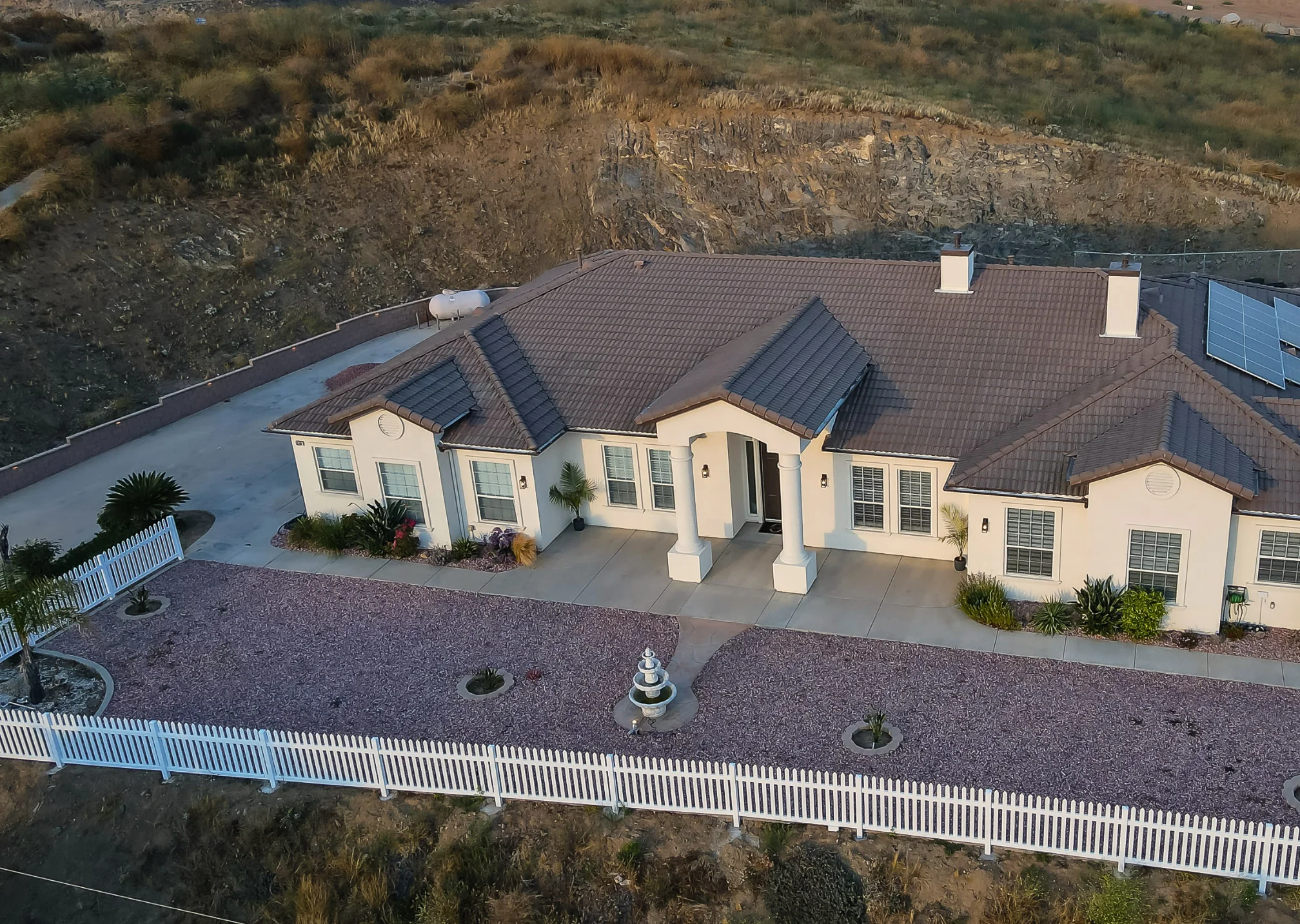 Aerial view of Manitou Home in Corona, California, with the surrounding hillside